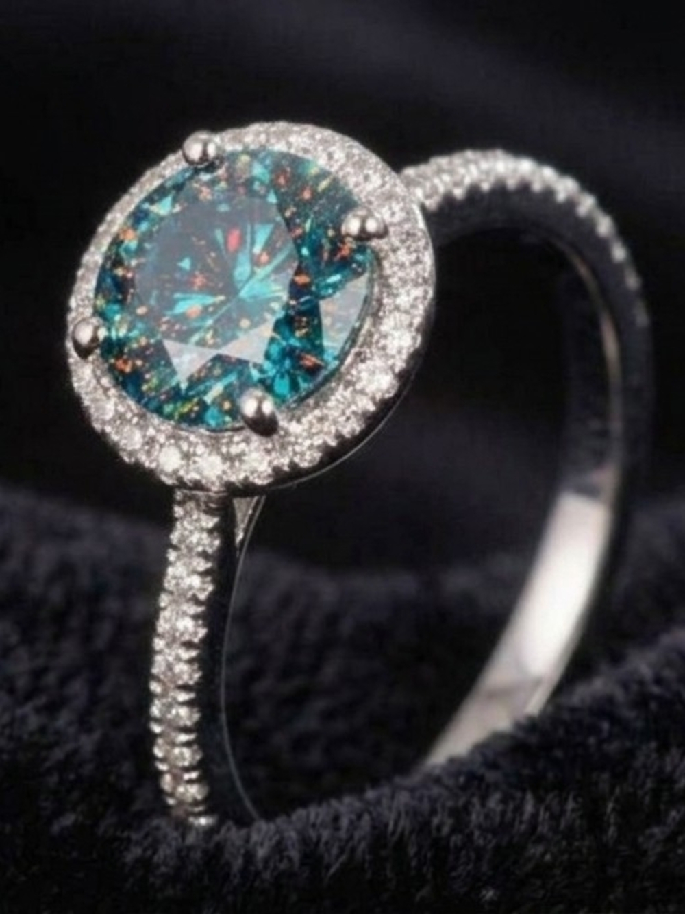 **IS IT GREEN?...IS IT BLUE?**
1.5 Carat Green/Blue Adjustable Moissanite Ring